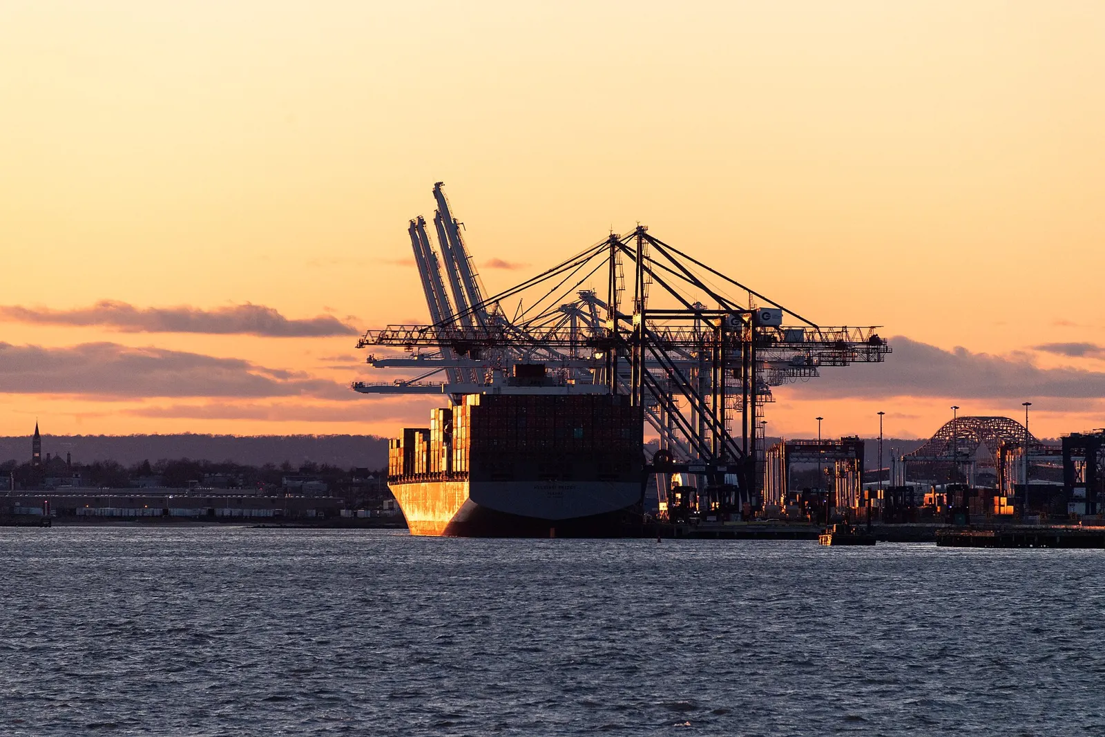 Container ship at Port Jersey, New York harbor, at sunset